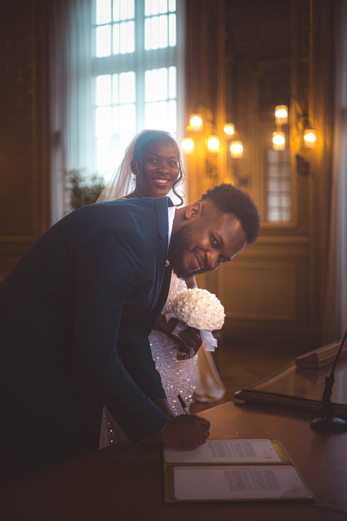 The Art of Drawing Readers In: Your attractive post title goes here A joyful bride and groom during their wedding ceremony indoors with warm lighting.